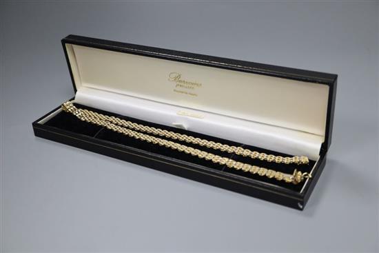 An 18ct yellow and white gold necklace (marked 18K & 750) of panther link design, 25g